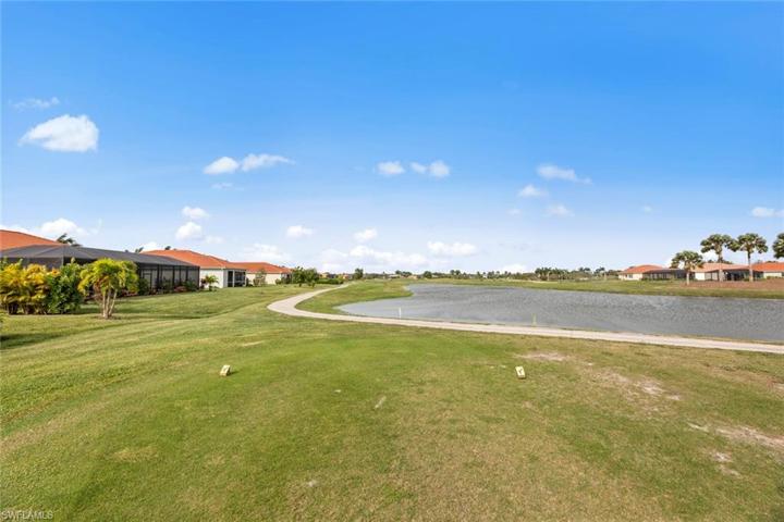 Enjoy the WATER, GOLF COURSE, and SUNSET VIEWS from your screened cage lanai.