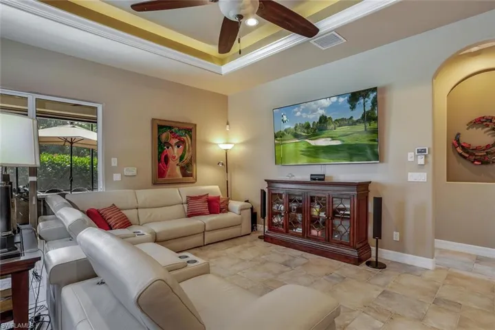 Family room with ceiling fan, coffer ceiling with crown molding