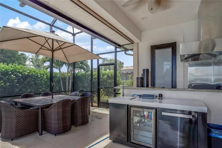 View of outdoor kitchen area with new stainless steel grill