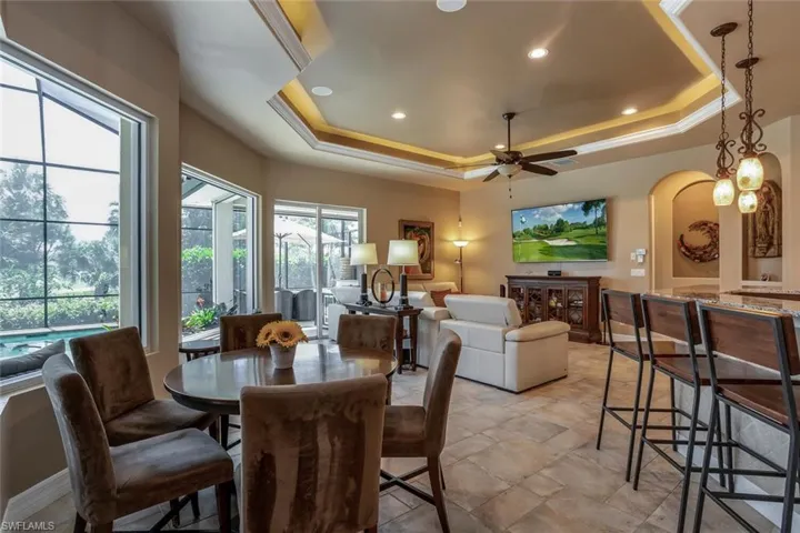 Dining space featuring a coffer ceiling and ceiling fan