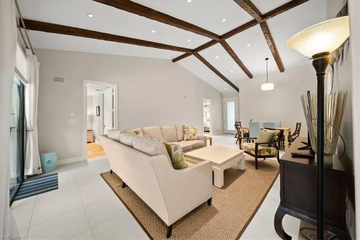 Living area with baseboards and recessed lighting
