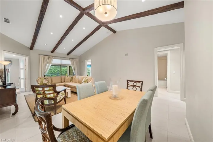 Dining space featuring light tile patterned floors and recessed lighting