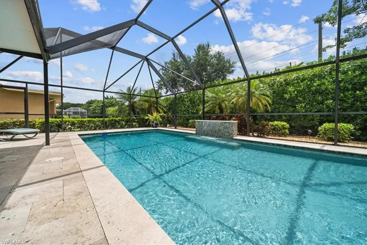 Outdoor pool with a patio area and a lanai
