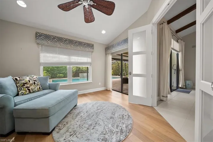 Sitting room featuring lofted ceiling, a ceiling fan, recessed lighting, and light wood-style flooring