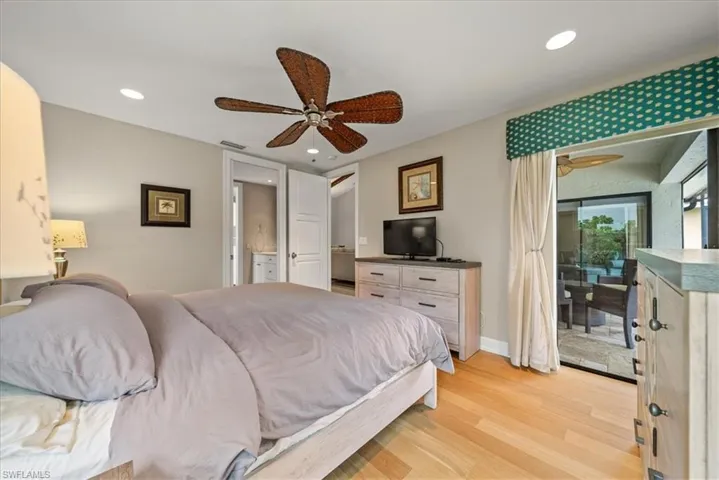 Bedroom with access to exterior, light wood-type flooring, recessed lighting, and a ceiling fan