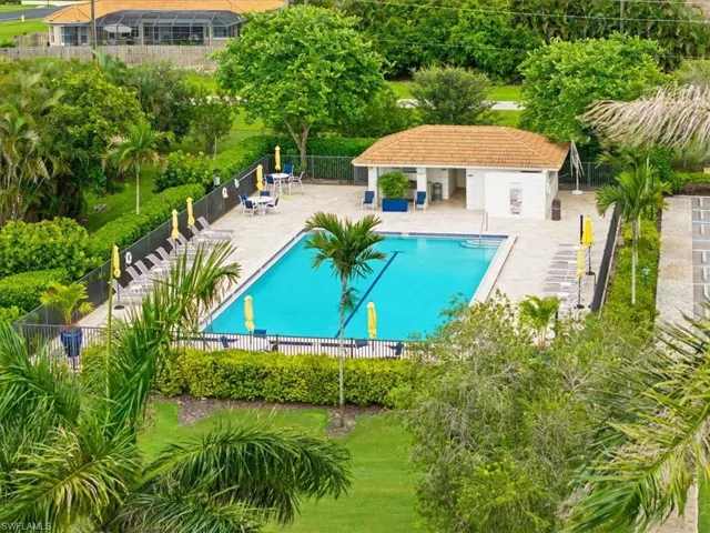 Community pool with a patio