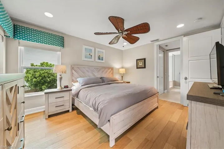 Bedroom featuring light wood finished floors, recessed lighting, and a ceiling fan