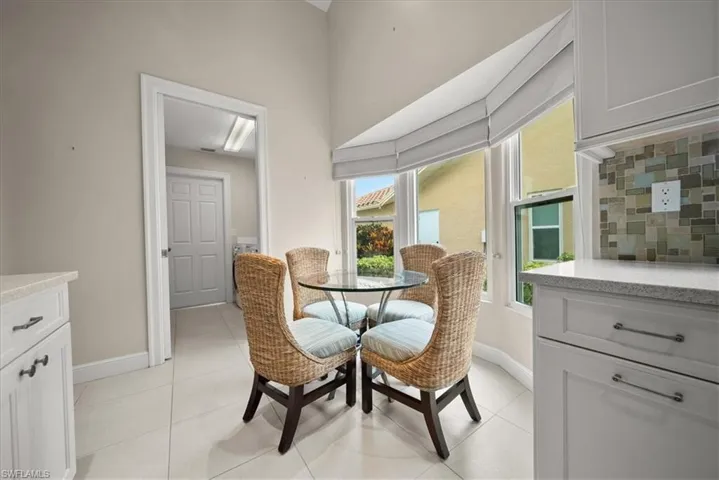 Dining room with baseboards and light tile patterned floors