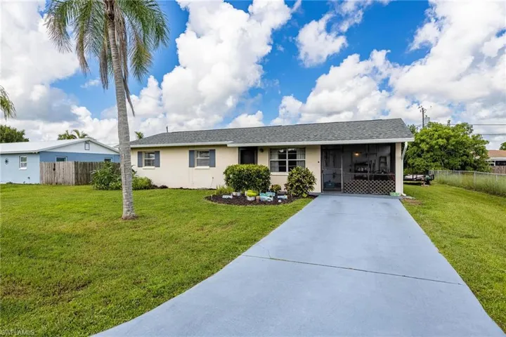 View of front of property with a front yard