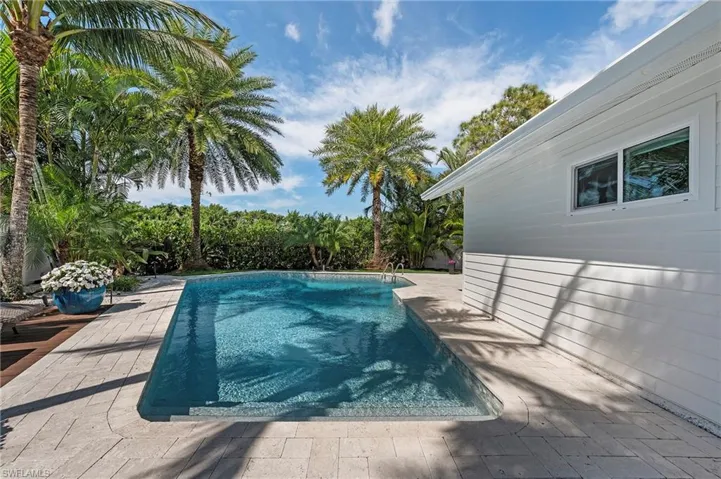 Outdoor pool featuring a patio area