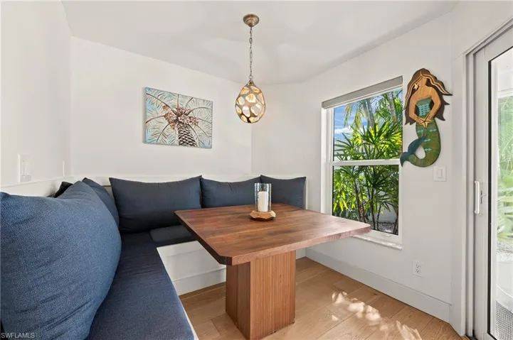 Dining space featuring breakfast area, light wood-style floors, and baseboards