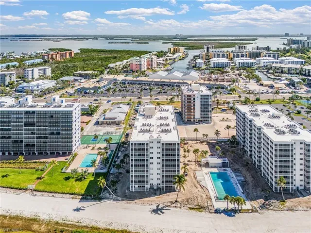 Aerial view of apartment complex / building and extended coastline - Virtually Edited Image