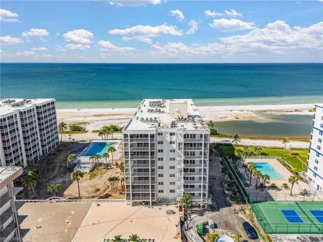 Bird's eye view of a pool area and apartment complex - Virtually Edited Image