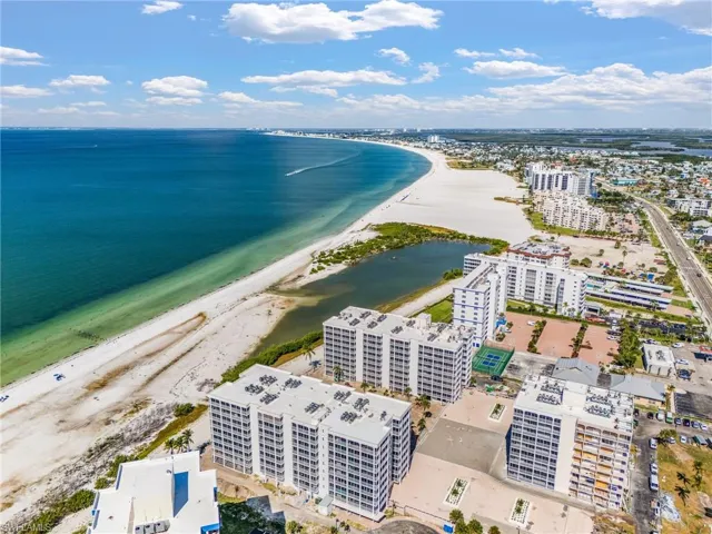 Aerial view of apartment complex / building and extended coastline - Virtually Edited Image