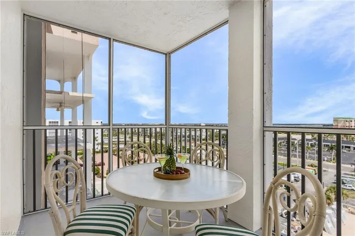 Balcony featuring a sunroom - Virtually Edited Image