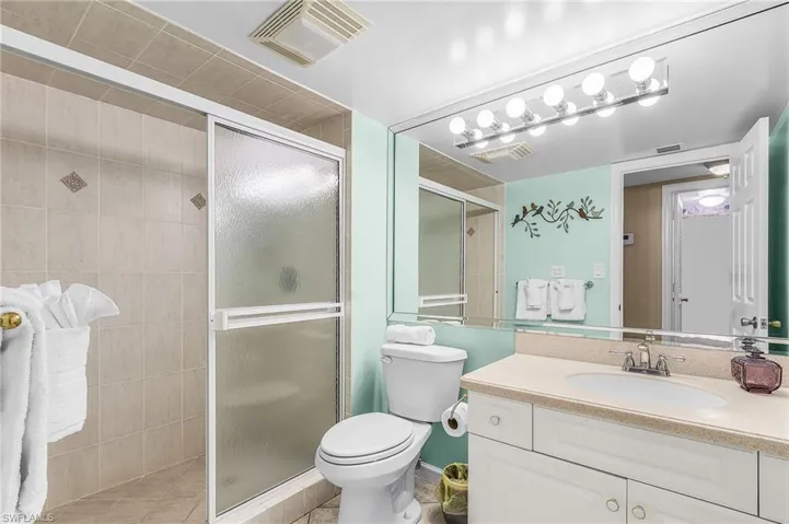 Bathroom with vanity and a shower stall - Virtually Edited Image