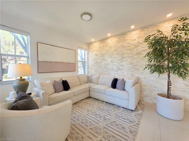 Tiled living area with recessed lighting