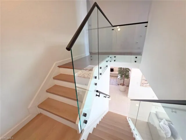 Staircase with wood finished floors