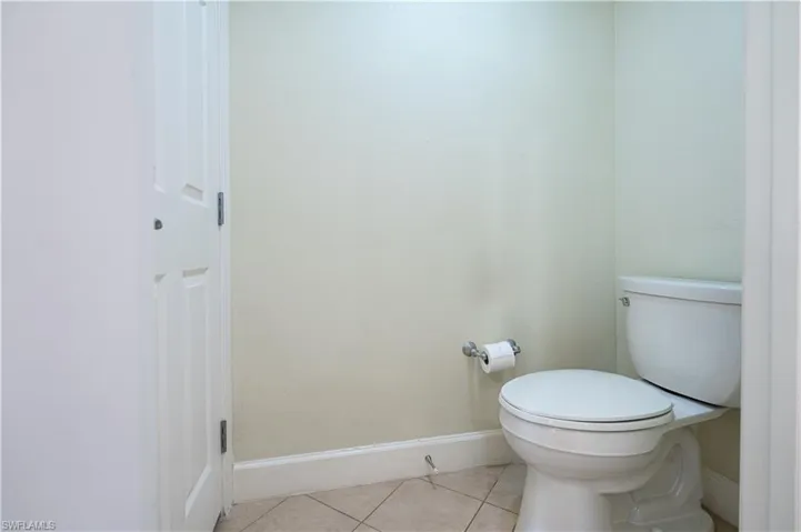 Bathroom with tile flooring and toilet