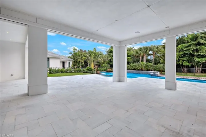 Expansive covered lanai with motorized screens