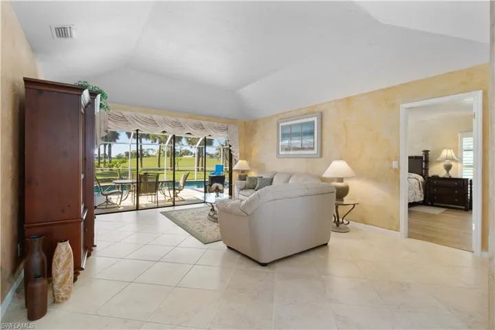 Living room featuring lofted ceiling