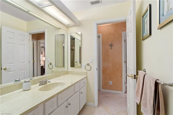 Bathroom featuring tile patterned floors and vanity
