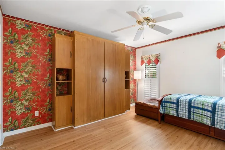 Bedroom featuring ceiling fan and light wood-type flooring