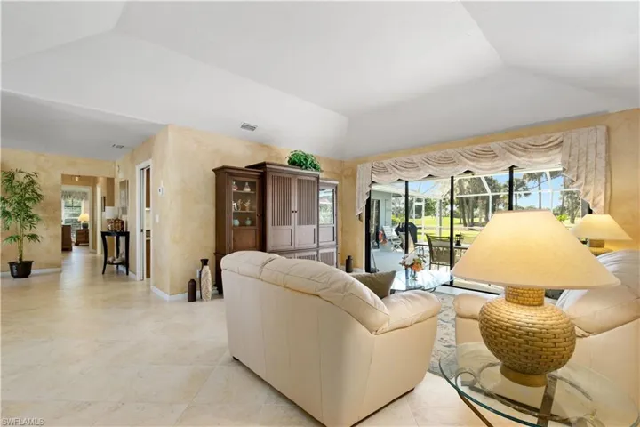 Living room with lofted ceiling