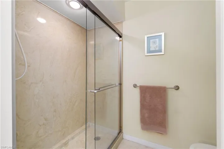 Bathroom with a shower with shower door