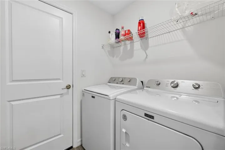Laundry area featuring washing machine and clothes dryer