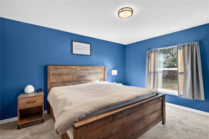 Bedroom with carpet and baseboards
