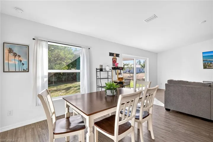 Dining area with wood finished floors and baseboards