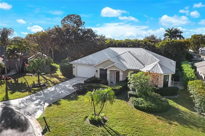 Welcome to this Former Model Home located in Sawgrass of Naples