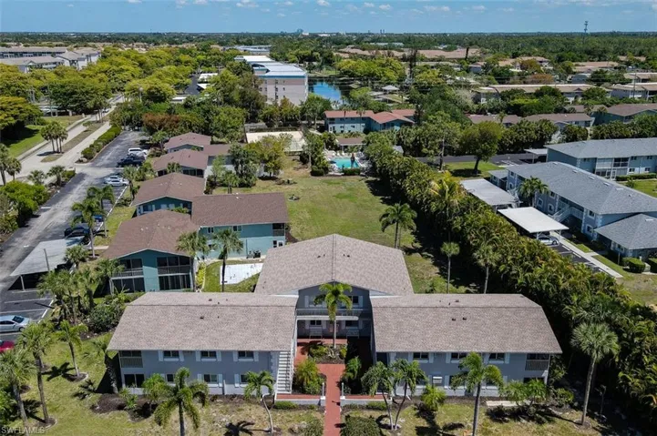 Aerial View of the condo building shows community Pool