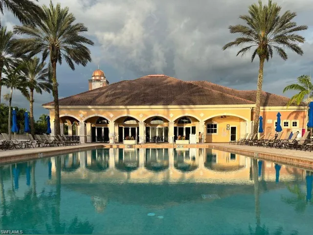 Community pool with a patio