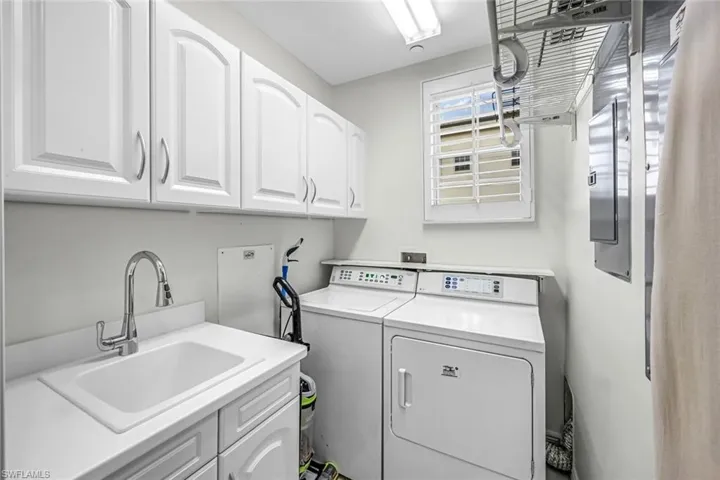 Laundry room with cabinet space and independent washer and dryer