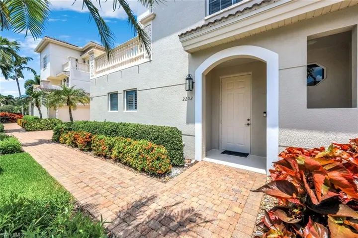 Entrance to property featuring stucco siding