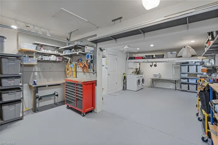 Basement featuring a workshop area and washer and clothes dryer