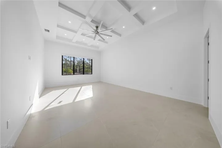 Unfurnished room with coffered ceiling, ceiling fan, and recessed lighting