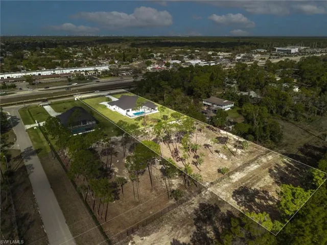 Aerial overview of property's location featuring property boundaries highlighted