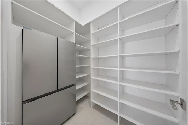 Walk-in pantry with refrigerator
