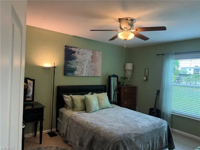 Tiled bedroom with ceiling fan
