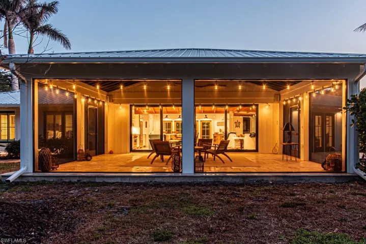 Rear view of house featuring french doors and metal roof