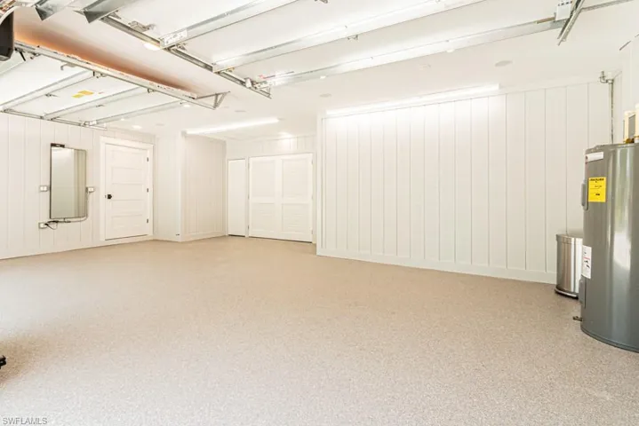Garage featuring electric water heater