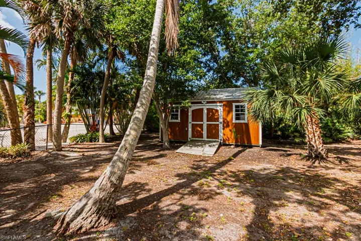 View of shed with fence