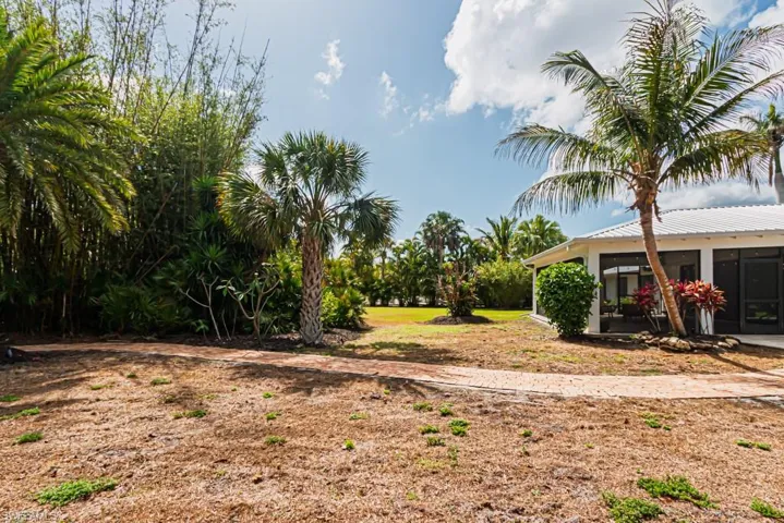 View of yard featuring a sunroom