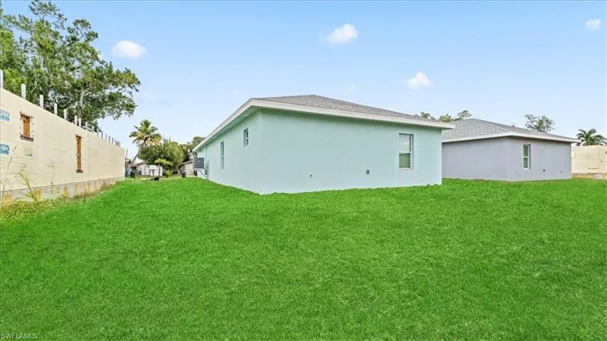 Rear view of house with stucco siding