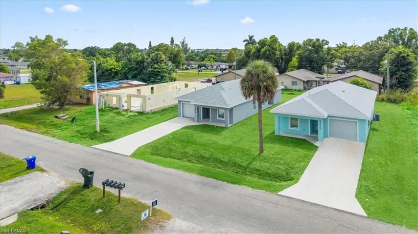 Aerial view of residential area with a tree filled landscape