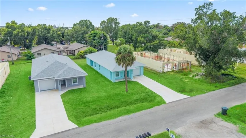 Aerial view of residential area featuring a tree filled landscape