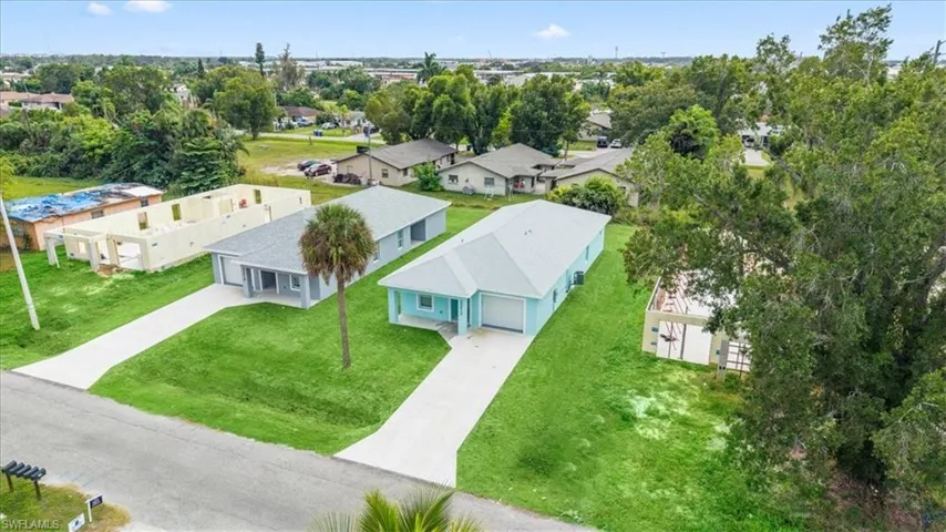 Aerial perspective of suburban area featuring a tree filled landscape